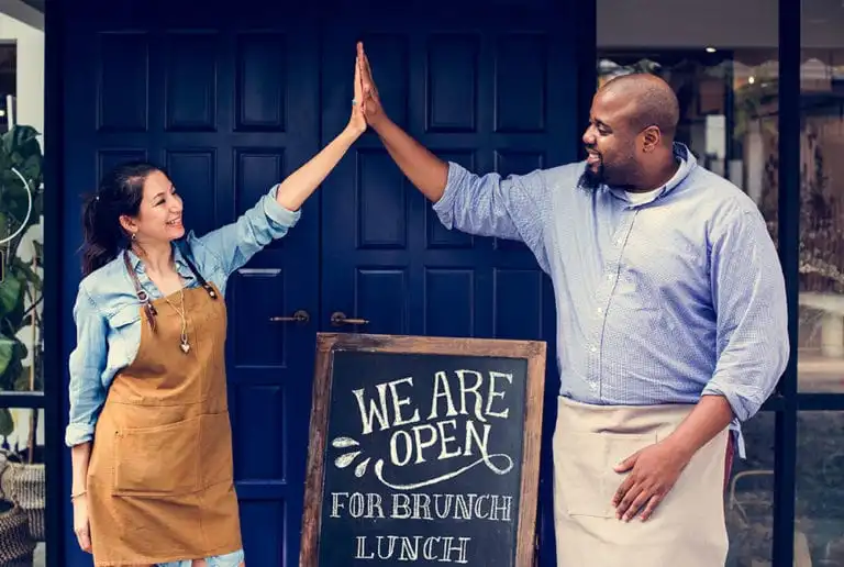 Smallbiz-high5-shutterstock_small2_1090064066-768x516-min