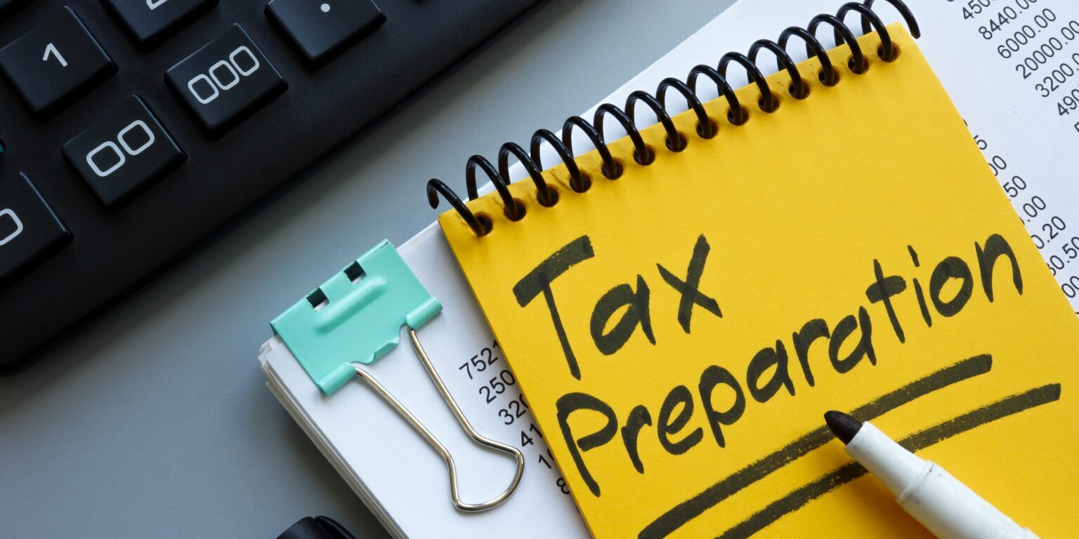 Tax,Preparation,Concept.,Stack,Of,Papers,And,Calculator.